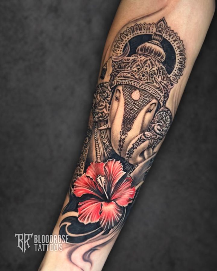 Dagdusheth Ganpati tattoo with red hibiscus